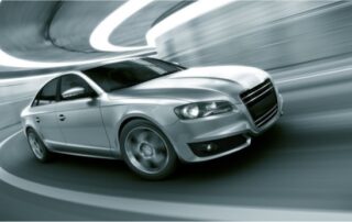 Silver sedan speeding through a tunnel representing reliable car repair services in Schofields